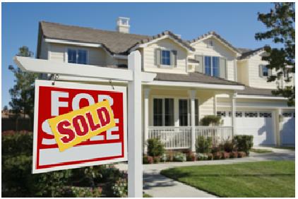 house with sold sign